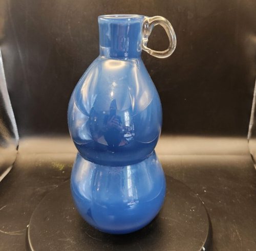 Blue 10-inch blown glass globe vase with clear handle and stacked design.