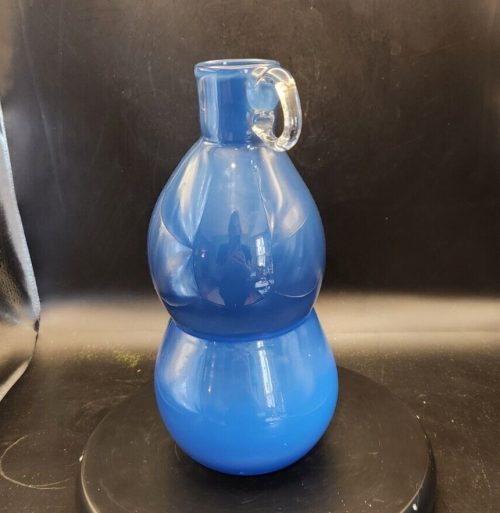 Blue blown glass globe vase with clear handle and stacked design, 10 inches tall.