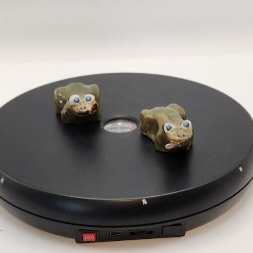 Two cute, derpy mini ceramic frog figurines for collection or decoration.