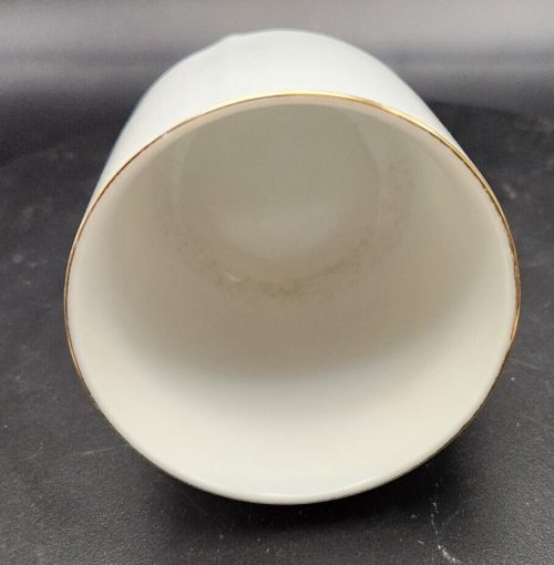 Hand-painted white China teacup with lid, decorative and collectible.