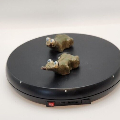 Two cute mini ceramic frogs with a funny, derpy expression.