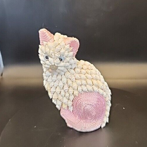 Pink and white seashell kitten figurine for decorative collectibles.