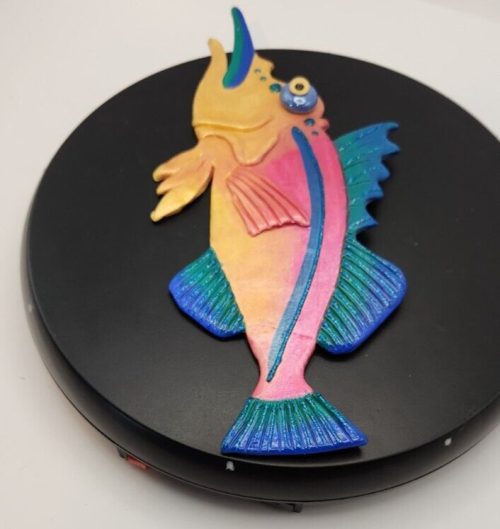 Repaired marlin fish with restored tail for ocean conservation and marine life projects.