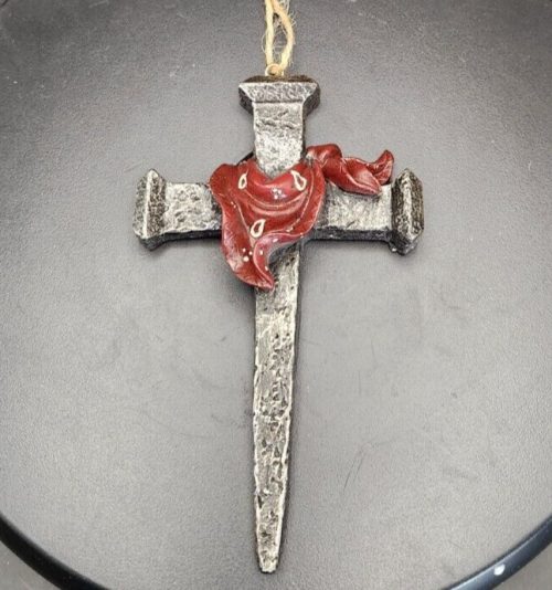 Resin nail art featuring a sculpted cross with bandana ornament.