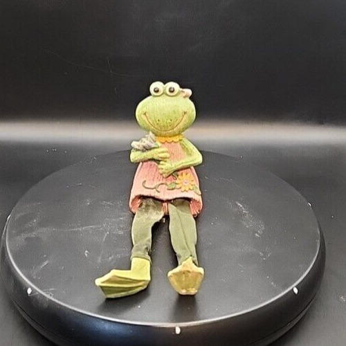 Smiling anthropomorphic frog shelf sitter figurine for home decor.