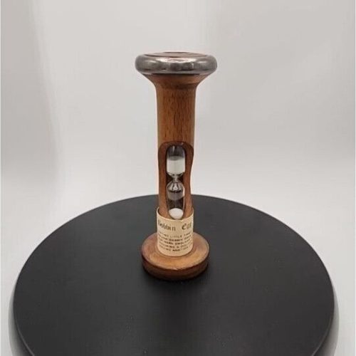 Vintage bobbin spool egg timer for sewing and craft use.