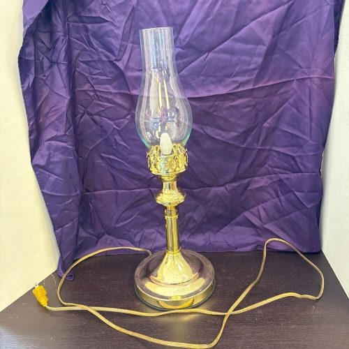Vintage brass plug-in lamp with hurricane shade and classic lighting design.