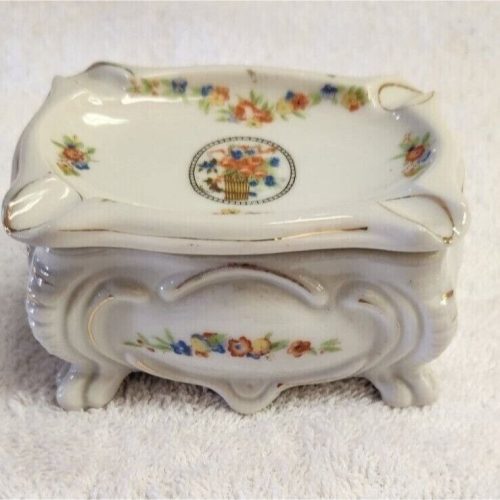 Vintage Japanese ceramic cigarette or trinket box with intricate design.