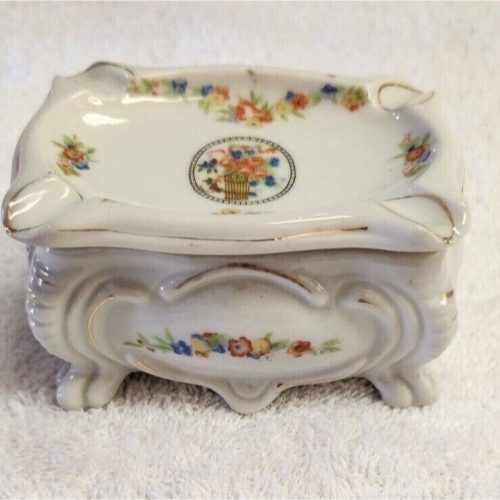 Vintage Japanese ceramic cigarette or trinket box with intricate design.
