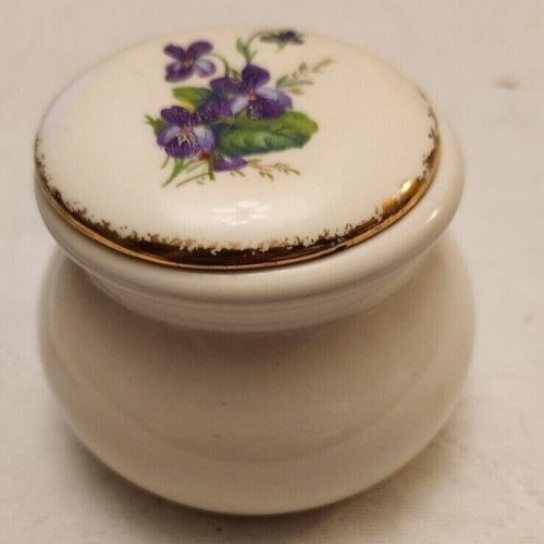 Vintage purple floral ceramic trinket box with gold trim for decorative jewelry storage.