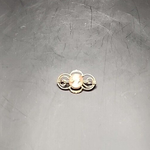 Vintage 12K gold filled cameo brooch with detailed carved portrait.