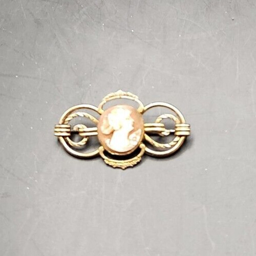 Elegant 12K Gold Filled Cameo Brooch with intricate design.