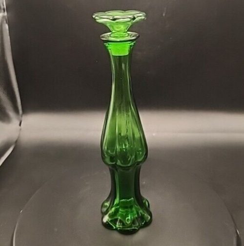 Avon green glass bud vase and empty cologne perfume bottle, 9 inches tall.