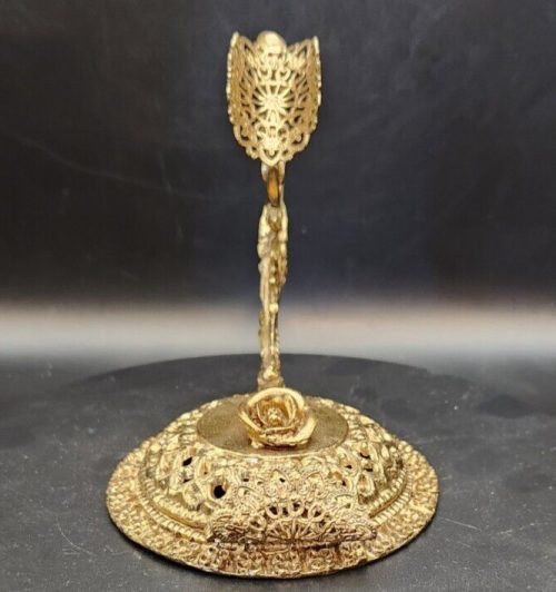 Brass wall hook with filigree design for hats and purses, 4.5 x 5 inches.