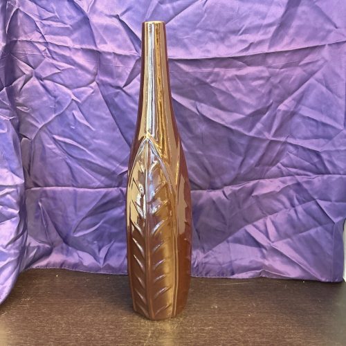 Tall brown art pottery vase with a glossy finish and handcrafted design for home decor.