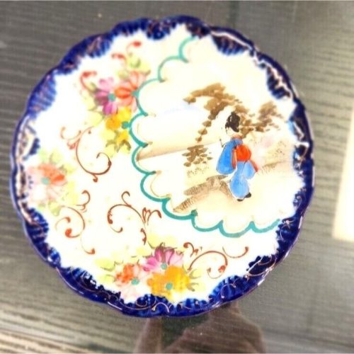 Japanese Madea porcelain collector plate with intricate traditional design.