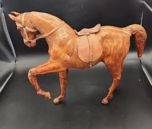 Handcrafted leather-wrapped horse figurine for home decor and equine collectibles.