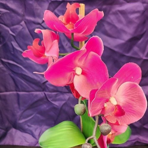 Beautiful pink faux orchid plant for home decor and artificial floral arrangements.