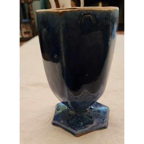 Handcrafted signed hexagonal stoneware drinking vessel with unique design.