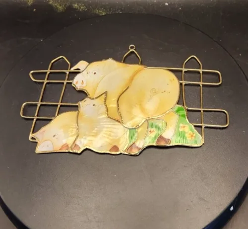 Colorful stained glass pig sun catcher for window decor.