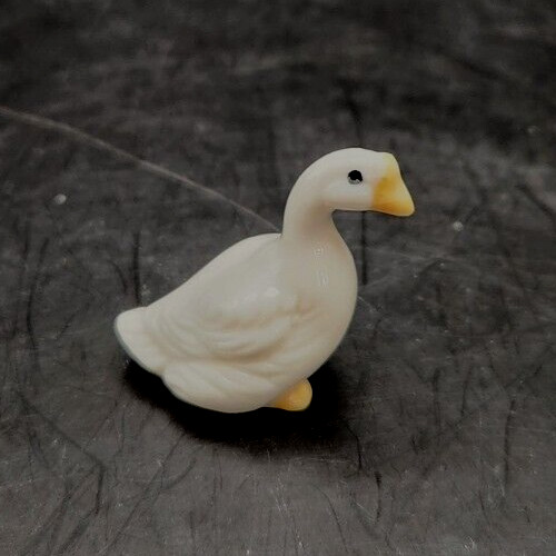 Ceramic duck figurine doubles as a decorative mini bug house, perfect for garden decor.