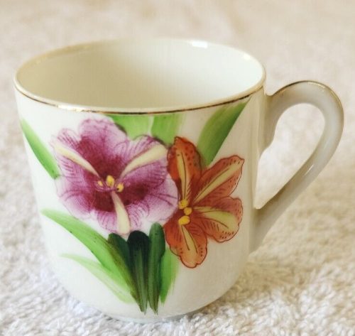 Vintage M.B. China Occupied Japan teacup with intricate design.