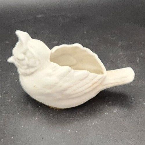 White bisque cardinal bird planter made in Germany on display.