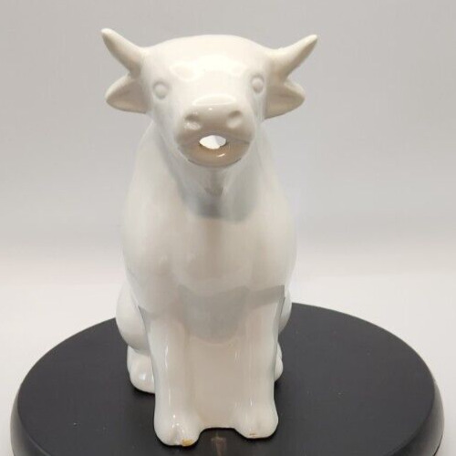 White ceramic cow pitcher for farmhouse kitchen décor.