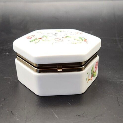 Avon 1983 porcelain holiday trinket box with dove and rose design, 1.75 inches tall.