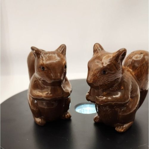 Brown squirrel salt and pepper shakers with nuts decorative tabletop accessories.