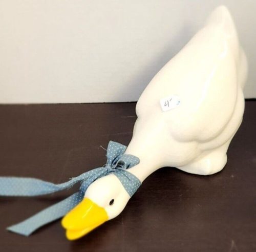 Handcrafted ceramic goose sculpture for home decor and garden ornament.