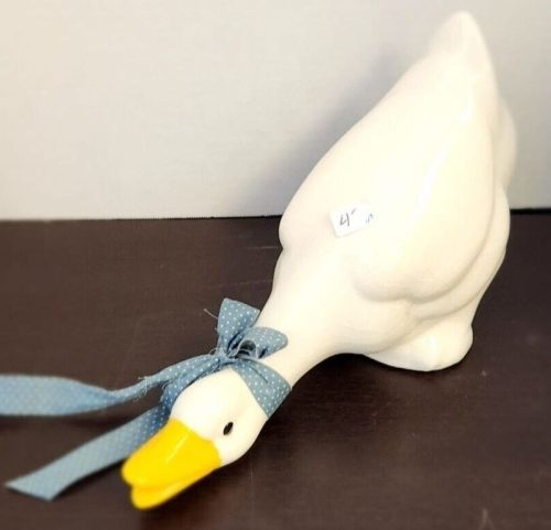 Decorative ceramic goose figurine for home decor and collectible display.