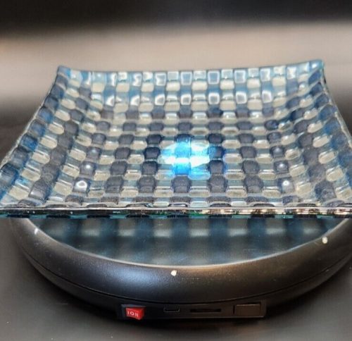 Fused glass decorative plate with intricate weave pattern, 8.5-inch diameter, artistic table decor.