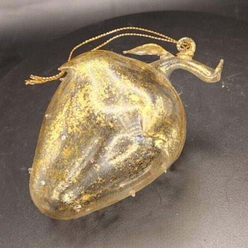 Gold glitter glass strawberry ornament for holiday decoration and table centerpiece.