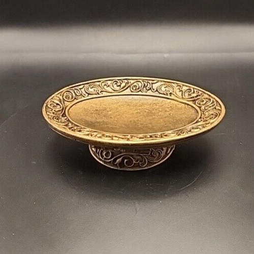 Gold ornate pedestal soap dish with decorative design for luxury bathroom decor.