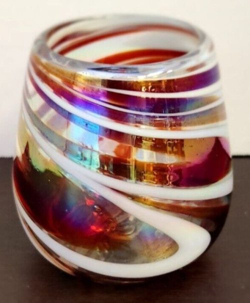 Red and white iridescent swirl stemless wine glass for elegant drinkware.