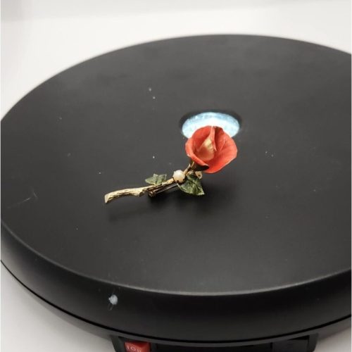 Orange and gold long stem rose brooch with pearl accent.