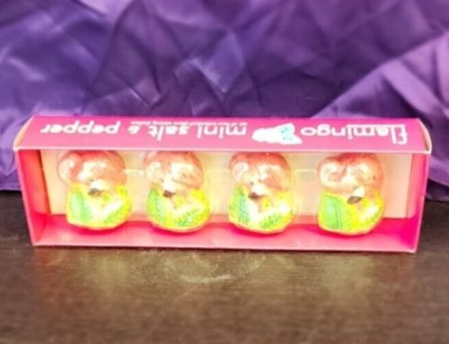 Set of four pink flamingo mini salt and pepper shakers.