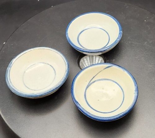 Set of 3 gray and blue stoneware tea bag rests for kitchen decor.