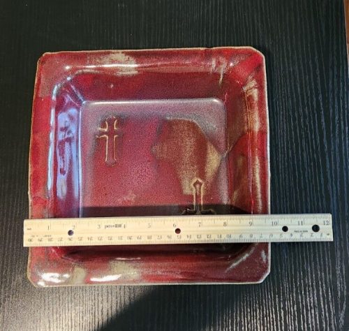Signed pottery glaze square religious dish with intricate designs, handmade and unique ceramic art piece.