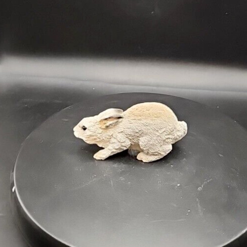 Handcrafted stone bunny figurine, adorable animal critter sculpture for home decor.