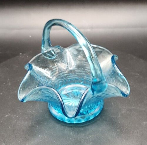 Vintage light blue glass candy dish with handle, 6-inch collectible glassware.